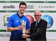 29 July 2022; Leinster Lightning captain George Dockrell, left, is presented with the IP T20 Trophy by Cricket Ireland president David Griffin during the Cricket Ireland Inter-Provincial Trophy match between Northern Knights and Leinster Lightning at Pembroke Cricket Club in Dublin. Photo by Sam Barnes/Sportsfile