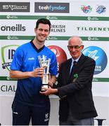29 July 2022; Leinster Lightning captain George Dockrell, left, is presented with the IP T20 Trophy by Cricket Ireland president David Griffin during the Cricket Ireland Inter-Provincial Trophy match between Northern Knights and Leinster Lightning at Pembroke Cricket Club in Dublin. Photo by Sam Barnes/Sportsfile