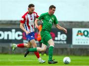 29 July 2022; Robert Martin of Usher Celtic in action against Dean George of Treaty United during the Extra.ie FAI Cup First Round match between Treaty United and Usher Celtic at Markets Field in Limerick. Photo by Michael P Ryan/Sportsfile