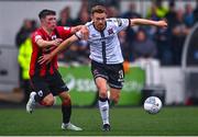 29 July 2022; Paul Doyle of Dundalk in action against Kian Corbally of Longford Town during the Extra.ie FAI Cup First Round match between Dundalk and Longford Town at Oriel Park in Dundalk, Louth. Photo by Ben McShane/Sportsfile