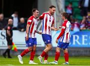 29 July 2022; Dean George of Treaty United, centre, celebrates after scoring his side's third goal with team-mate Joel Coustrain, left and William Armshaw during the Extra.ie FAI Cup First Round match between Treaty United and Usher Celtic at Markets Field in Limerick. Photo by Michael P Ryan/Sportsfile