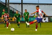 29 July 2022; Enda Curran of Treaty United  shoots to score his side's fourth goal from a penalty during the Extra.ie FAI Cup First Round match between Treaty United and Usher Celtic at Markets Field in Limerick. Photo by Michael P Ryan/Sportsfile
