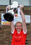 30 July 2022; Kilkerrin Clonberne captain Louise Ward, from Galway, lifts the cup after victory over Fethard of Tipperary in the Currentaccount.ie All-Ireland Ladies Football Senior Club 7-a-side championship final at Naomh Mearnóg's GAA club in Dublin. Photo by Brendan Moran/Sportsfile