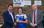30 July 2022; Fethard captain Lucy Spillane, from Tipperary, is presented with her runners-up trophy by Uachtarán Cumann Peil Gael na mBan, Mícheál Naughton, left, and currentaccount.ie chief executive officer Seamus Newcombe after the Currentaccount.ie All-Ireland Ladies Football Senior Club 7-a-side championship final at Naomh Mearnóg's GAA club in Dublin. Photo by Brendan Moran/Sportsfile