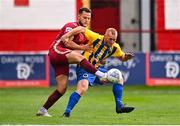 31 July 2022; Nathan Benson of Bluebell United in action against Max Hemmings of Galway United during the Extra.ie FAI Cup First Round match between Bluebell United and Galway United at Tolka Park in Dublin. Photo by Ben McShane/Sportsfile