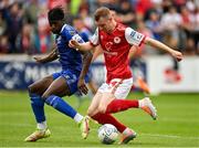 31 July 2022; Mark Doyle of St Patrick's Athletic is fouled by Tunmise Sobowale of Waterford, resulting in a penalty, during the Extra.ie FAI Cup First Round match between St Patrick's Athletic and Waterford at Richmond Park in Dublin. Photo by Seb Daly/Sportsfile