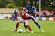 31 July 2022; Mark Doyle of St Patrick's Athletic in action against Tunmise Sobowale of Waterford during the Extra.ie FAI Cup First Round match between St Patrick's Athletic and Waterford at Richmond Park in Dublin. Photo by Seb Daly/Sportsfile