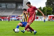 31 July 2022; Oisín O'Reilly of Galway United in action against Nathan Bell of Bluebell United during the Extra.ie FAI Cup First Round match between Bluebell United and Galway United at Tolka Park in Dublin. Photo by Ben McShane/Sportsfile