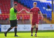 31 July 2022; David Tarmey of Galway United and Bluebell United goalkeeper Michael Quinn after the Extra.ie FAI Cup First Round match between Bluebell United and Galway United at Tolka Park in Dublin. Photo by Ben McShane/Sportsfile