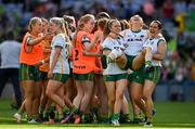 31 July 2022; Meath players Ailbhe Leahy, left, and Niamh Gallogly carry injured teammate Aoibheann Leahy as they celebrate at the final whistle of the TG4 All-Ireland Ladies Football Senior Championship Final match between Kerry and Meath at Croke Park in Dublin. Photo by Brendan Moran/Sportsfile