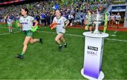 31 July 2022; Emma Troy, left, and Megan Thynne of Meath  run out past the Brendan Martin cup before the TG4 All-Ireland Ladies Football Senior Championship Final match between Kerry and Meath at Croke Park in Dublin. Photo by Brendan Moran/Sportsfile