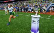 31 July 2022; Vikki Wall of Meath runs out past the Brendan Martin cup before the TG4 All-Ireland Ladies Football Senior Championship Final match between Kerry and Meath at Croke Park in Dublin. Photo by Brendan Moran/Sportsfile