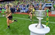 31 July 2022; The Brendan Martin cup as Kerry run onto the pitch before the TG4 All-Ireland Ladies Football Senior Championship Final match between Kerry and Meath at Croke Park in Dublin. Photo by Brendan Moran/Sportsfile