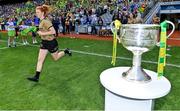 31 July 2022; Louise Ní Mhuircheartaigh of Kerry runs out past the Brendan Martin cup before the TG4 All-Ireland Ladies Football Senior Championship Final match between Kerry and Meath at Croke Park in Dublin. Photo by Brendan Moran/Sportsfile