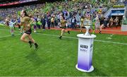 31 July 2022; Kayleigh Cronin of Kerry runs out past the Brendan Martin cup before the TG4 All-Ireland Ladies Football Senior Championship Final match between Kerry and Meath at Croke Park in Dublin. Photo by Brendan Moran/Sportsfile