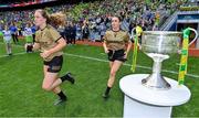 31 July 2022; Síofra O'Shea, left, and Cáit Lynch of Kerry run out past the Brendan Martin cup before the TG4 All-Ireland Ladies Football Senior Championship Final match between Kerry and Meath at Croke Park in Dublin. Photo by Brendan Moran/Sportsfile