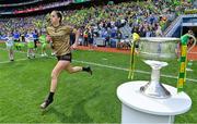 31 July 2022; Emma Costello of Kerry runs out past the Brendan Martin cup before the TG4 All-Ireland Ladies Football Senior Championship Final match between Kerry and Meath at Croke Park in Dublin. Photo by Brendan Moran/Sportsfile