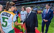 31 July 2022; President of Ireland Michael D Higgins is introduced to Niamh O'Sullivan of Meath by team captain Shauna Ennis, in the company of Uachtarán Cumann Peil Gael na mBan, Mícheál Naughton, before the TG4 All-Ireland Ladies Football Senior Championship Final match between Kerry and Meath at Croke Park in Dublin. Photo by Brendan Moran/Sportsfile