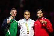 1 August 2022; Athletes, from left, Rhys McClenaghan of Northern Ireland with his Silver medal, Joe Fraser of England with his Gold medal and Jayson Rampersad of Canada with his Bronze medal after competing in the men's pommel horse final at Arena Birmingham in Birmingham, England. Photo by Paul Greenwood/Sportsfile