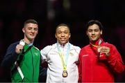 1 August 2022; Athletes, from left, Rhys McClenaghan of Northern Ireland with his Silver medal, Joe Fraser of England with his Gold medal and Jayson Rampersad of Canada with his Bronze medal after competing in the men's pommel horse final at Arena Birmingham in Birmingham, England. Photo by Paul Greenwood/Sportsfile