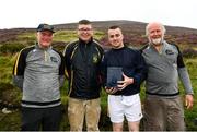 1 August 2022; Cormac Gough of Derry with, from left, National Poc Fada Committee Cathaoirleach Tom Ryan, Ard Stiúrthóir of the GAA Tom Ryan and event sponsor Martin Donnelly after the M. Donnelly GAA All-Ireland Poc Fada Finals at Cooley Mountains in Louth. Photo by Harry Murphy/Sportsfile