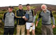 1 August 2022; Cillian Kiely of Offaly with, from left, National Poc Fada Committee Cathaoirleach Tom Ryan, Ard Stiúrthóir of the GAA Tom Ryan and event sponsor Martin Donnelly after the M. Donnelly GAA All-Ireland Poc Fada Finals at Cooley Mountains in Louth. Photo by Harry Murphy/Sportsfile
