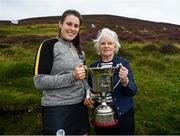 1 August 2022; Molly Lynch of Cork is presented the trophy by Ulster Camogie chairperson Deidre McGrath after the M. Donnelly GAA All-Ireland Poc Fada Finals at Cooley Mountains in Louth. Photo by Harry Murphy/Sportsfile