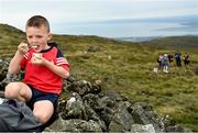 1 August 2022; Eoin McCormack, aged six, enjoys a yoghurt during the M. Donnelly GAA All-Ireland Poc Fada Finals at Cooley Mountains in Louth. Photo by Harry Murphy/Sportsfile