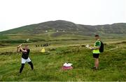 1 August 2022; Anthony Daly of Galway takes a shot watched by referee and inter-county hurling referee Sean Stack during the M. Donnelly GAA All-Ireland Poc Fada Finals at Cooley Mountains in Louth. Photo by Harry Murphy/Sportsfile