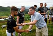 1 August 2022; Ard Stiúrthóir of the GAA Tom Ryan presents a sliotar to Colin Ryan of Limerick during the M. Donnelly GAA All-Ireland Poc Fada Finals at Cooley Mountains in Louth. Photo by Harry Murphy/Sportsfile