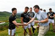 1 August 2022; Ard Stiúrthóir of the GAA Tom Ryan presents a sliotar to Brian Treacy of Carlow during the M. Donnelly GAA All-Ireland Poc Fada Finals at Cooley Mountains in Louth. Photo by Harry Murphy/Sportsfile