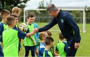 2 August 2022; Republic of Ireland manager Stephen Kenny with attendees during a visit to the INTERSPORT Elverys Summer Soccer Schools at Tullamore Town FC in Leah Victoria Park, Tullamore, Offaly. Photo by Harry Murphy/Sportsfile