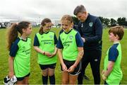 2 August 2022; Republic of Ireland manager Stephen Kenny signs a jersey for Ava Boland during a visit to the INTERSPORT Elverys Summer Soccer Schools at Tullamore Town FC in Leah Victoria Park, Tullamore, Offaly. Photo by Harry Murphy/Sportsfile