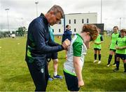 2 August 2022; Republic of Ireland manager Stephen Kenny signs a jersey for Halle Thornton during a visit to the INTERSPORT Elverys Summer Soccer Schools at Tullamore Town FC in Leah Victoria Park, Tullamore, Offaly. Photo by Harry Murphy/Sportsfile