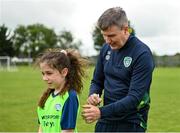 2 August 2022; Republic of Ireland manager Stephen Kenny signs a jersey for Freya Grennan during a visit to the INTERSPORT Elverys Summer Soccer Schools at Tullamore Town FC in Leah Victoria Park, Tullamore, Offaly. Photo by Harry Murphy/Sportsfile