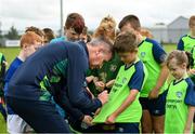 2 August 2022; Republic of Ireland manager Stephen Kenny signs a jersey for Reilly McEvoy during a visit to the INTERSPORT Elverys Summer Soccer Schools at Tullamore Town FC in Leah Victoria Park, Tullamore, Offaly. Photo by Harry Murphy/Sportsfile