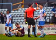 1 August 2022; Referee Robert Harvey issues a red card to Thomas Lonergan of UCD, which is later rescinded, during the SSE Airtricity League Premier Division match between Drogheda United and UCD at Head in the Game Park in Drogheda, Louth. Photo by Ben McShane/Sportsfile