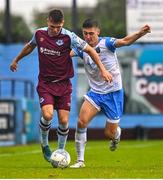 1 August 2022; Dayle Rooney of Drogheda United in action against Dylan Duffy of UCD during the SSE Airtricity League Premier Division match between Drogheda United and UCD at Head in the Game Park in Drogheda, Louth. Photo by Ben McShane/Sportsfile