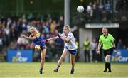 3 August 2022; Megan Glennon of Longford kicks a point despite Leah Connolly of Monaghan during the ZuCar All-Ireland Ladies Football Minor B Championship Final match between Monaghan and Longford at Donaghmore Ashbourne GAA club in Ashbourne, Meath. Photo by David Fitzgerald/Sportsfile