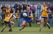 3 August 2022; Aobha Harmon of Wicklow in action against Clare players, from left, Caoimhe Cahill, Lauren Conway and Eimer Clune during the ZuCar All-Ireland Ladies Football Minor ‘C’ Championship Final match between Clare and Wicklow at Kinnegad GAA club in Kinnegad, Westmeath. Photo by Piaras Ó Mídheach/Sportsfile