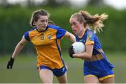 3 August 2022; Laci-Jane Shannon of Wicklow in action against Lauren Conway of Clare during the ZuCar All-Ireland Ladies Football Minor ‘C’ Championship Final match between Clare and Wicklow at Kinnegad GAA club in Kinnegad, Westmeath. Photo by Piaras Ó Mídheach/Sportsfile