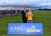 3 August 2022; Abby Downes receives the Player of the Match award from Trina Murray, Leinster LGFA President and LGFA vice-President, after the ZuCar All-Ireland Ladies Football Minor ‘C’ Championship Final match between Clare and Wicklow at Kinnegad GAA club in Kinnegad, Westmeath. Photo by Piaras Ó Mídheach/Sportsfile
