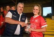 3 August 2022; Abigail Ring of Cork receives the Player of the Match award from Robbie Smith, Munster LGFA President and vice-President of the LGFA, after during the ZuCar All-Ireland Ladies Football Minor ‘A’ Championship Final match between Cork and Galway at MacDonagh Park in Nenagh, Tipperary. Photo by Harry Murphy/Sportsfile