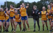 3 August 2022; Gráinne Burke of Clare, centre, celebrates with temmates after their side's victory in the ZuCar All-Ireland Ladies Football Minor ‘C’ Championship Final match between Clare and Wicklow at Kinnegad GAA club in Kinnegad, Westmeath. Photo by Piaras Ó Mídheach/Sportsfile
