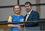 3 August 2022; LGFA President Mícheál Naughton presents the player of the match to Sián Gallagher of Longford after the ZuCar All-Ireland Ladies Football Minor B Championship Final match between Monaghan and Longford at Donaghmore Ashbourne GAA club in Ashbourne, Meath. Photo by David Fitzgerald/Sportsfile