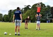 4 August 2022; Coach Fionn Gilbert views participants practicing their lineout catching during the Bank of Ireland Leinster Rugby School of Excellence at The King's Hospital School in Dublin. Photo by Ben McShane/Sportsfile