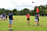 4 August 2022; Coach Fionn Gilbert views participants practicing their lineout catching during the Bank of Ireland Leinster Rugby School of Excellence at The King's Hospital School in Dublin. Photo by Ben McShane/Sportsfile