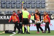4 August 2022; Referee Marian Petrescu shows a yellow card to Garry Buckley of Sligo as he is stretchered off the pitch after receiving an injury during the UEFA Europa Conference League third qualifying round first leg match between Viking and Sligo Rovers at SR-Bank Arena in Stavanger, Norway. Photo by James Fallon/Sportsfile