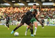 4 August 2022; Senghor Faustin of Shkupi in action against Andy Lyons of Shamrock Rovers during the UEFA Europa League third qualifying round first leg match between Shamrock Rovers and Shkupi at Tallaght Stadium in Dublin. Photo by Eóin Noonan/Sportsfile