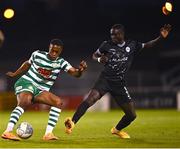 4 August 2022; Aidomo Emakhu of Shamrock Rovers in action against Diene Albert Lamane of Shkupi during the UEFA Europa League third qualifying round first leg match between Shamrock Rovers and Shkupi at Tallaght Stadium in Dublin. Photo by Eóin Noonan/Sportsfile